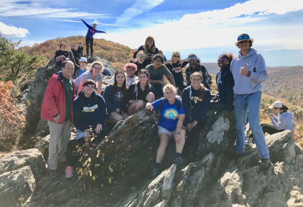 Students posing for photo on mountaintop